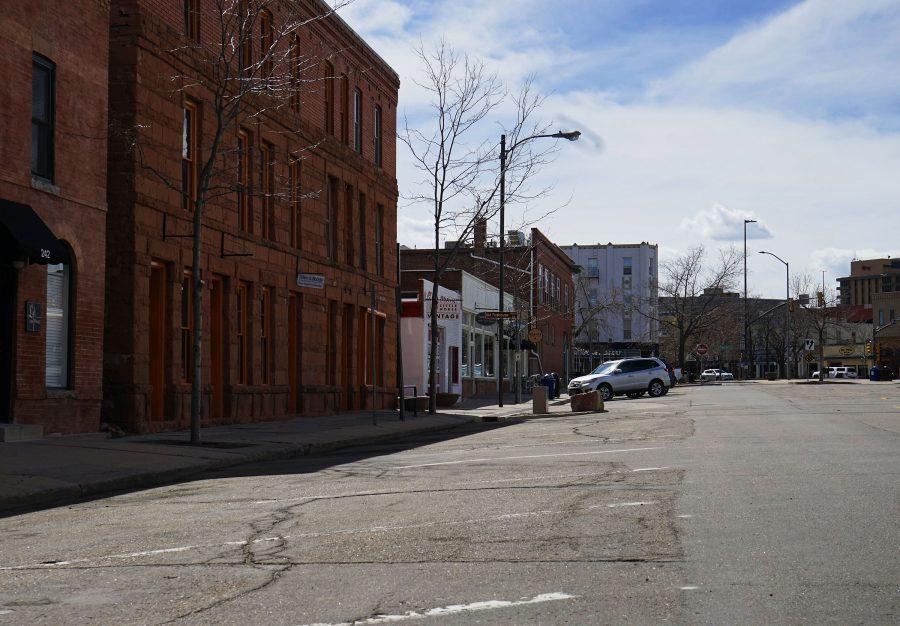 Old Town parking, which shoppers fought over just a week ago, remains empty after the CDC recommended non-essential workers stay in their homes. (Lauryn Bolz | The Collegian)