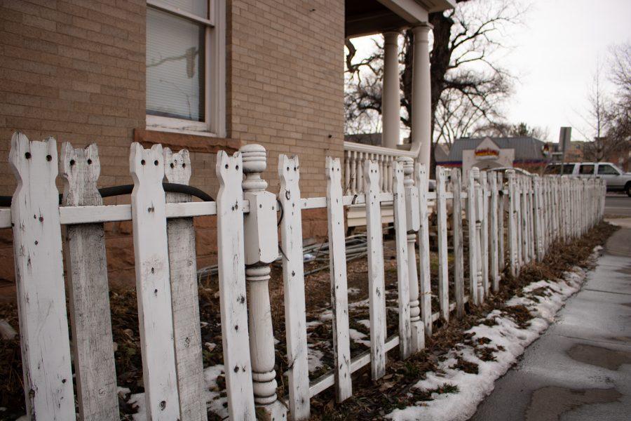 Cars wait at a College Avenue stop light across from the Cat Fence. (Devin Cornelius | Collegian)