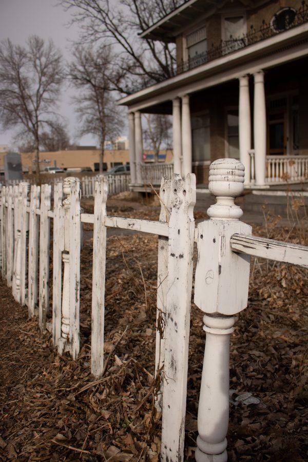 The cat fence on East Mulberry and College Avenue, is missing several of its pickets. (Devin Cornelius | Collegian)