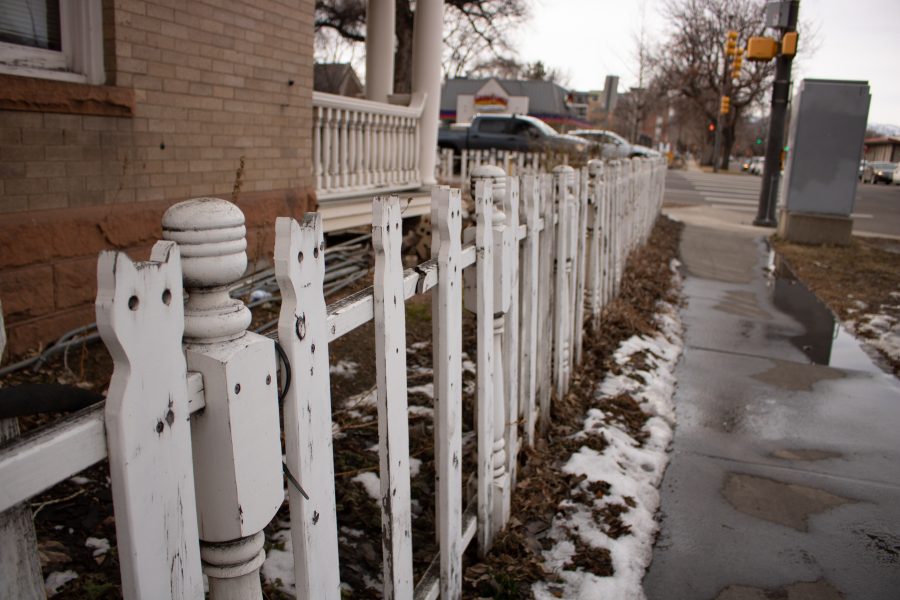 Cars wait at a College Avenue stop light across from the Cat Fence. (Devin Cornelius | Collegian)