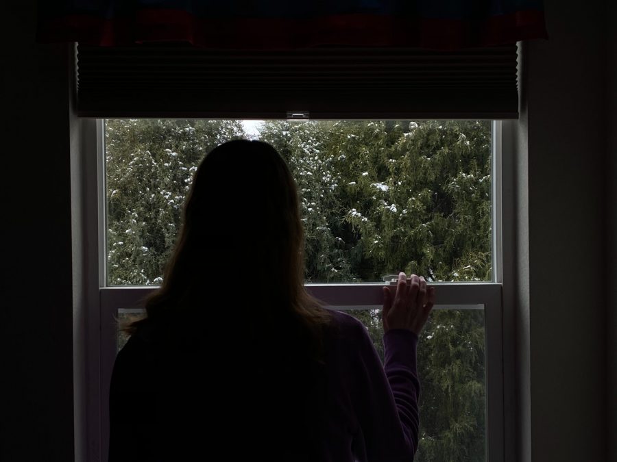 Mary McGregor stands in front of a window on the upstairs floor of her house April 12. She has been self-quarantining and following stay-at-home orders issued by Adams County and the state of Colorado amid the COVID-19 pandemic. (Megan McGregor | The Collegian)