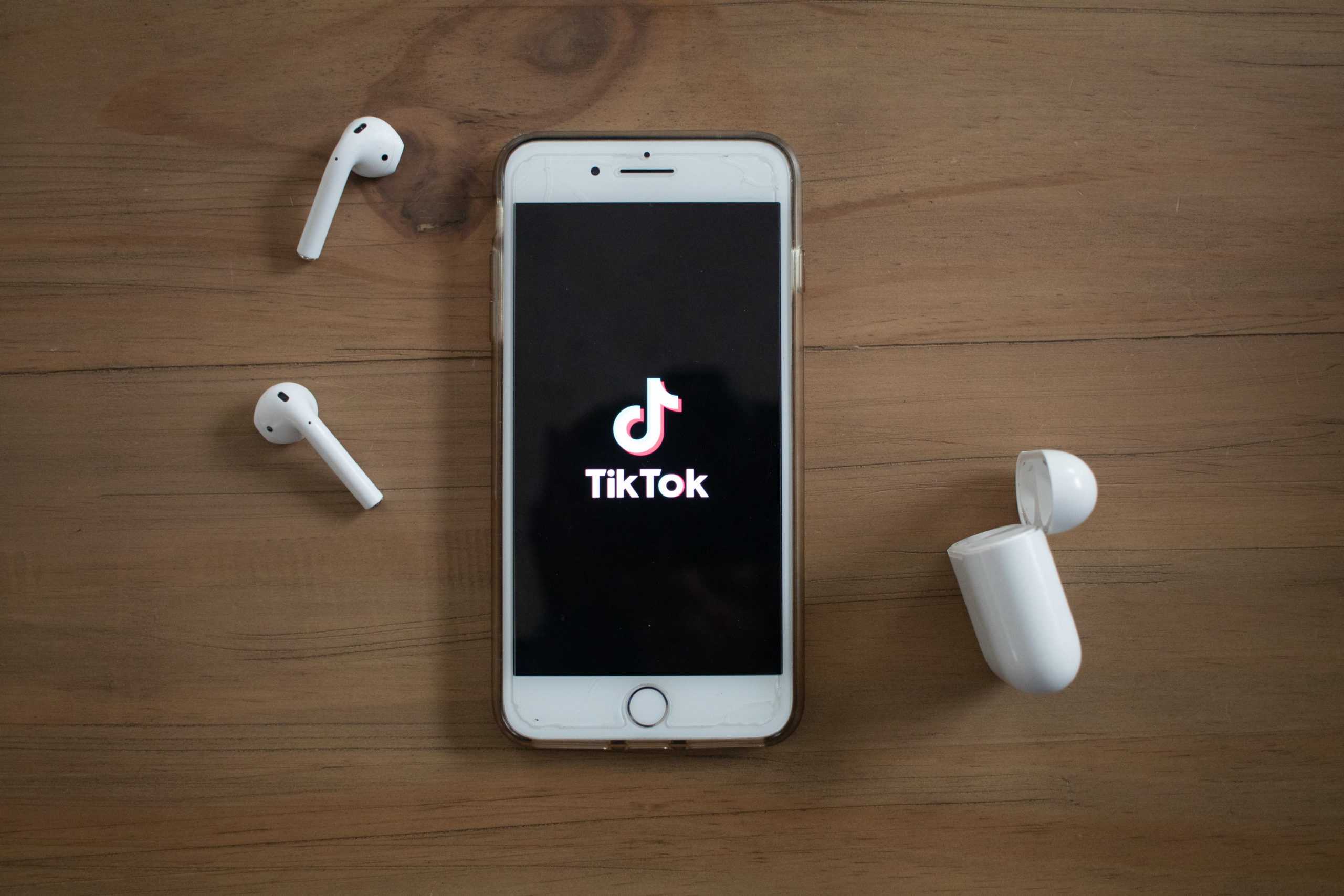 phone on table with tiktok app opened