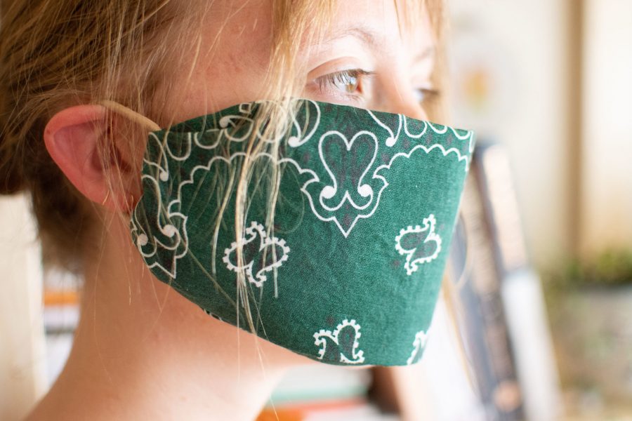 Following instructions on the Center for Disease Controls website, a reusable cloth facemark can be made at home from a bandana, a coffee filter, two hair ties and a pair of scissors. (Matt Tackett | The Collegian)