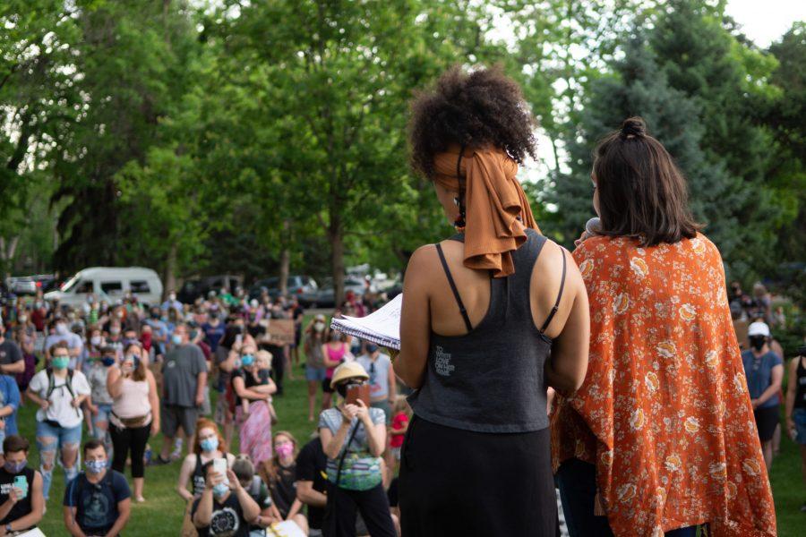 Missy Splittgerber (left) and Melissa Lozano Davis (right) speak next to Sheldon Lake in City Park on May 31 as part of the “Another World is Possible” march. According to the march’s Facebook page the goal was to get the Fort Collins community to “walk toward change and justice.” (Matt Tackett | The Collegian)