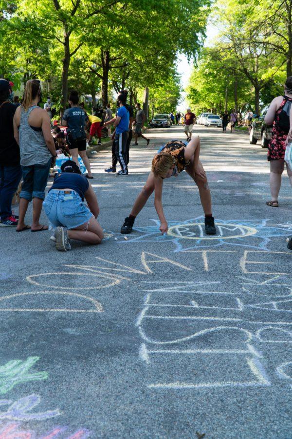 Demonstrators outside Hennepin County Attorney Mike Freemans house using chalk to draw black lives matters imagery. The protests are in response to the killing of George Floyd. Thursday, May 28, 2020. (Photo courtesy of Ben Leonard)