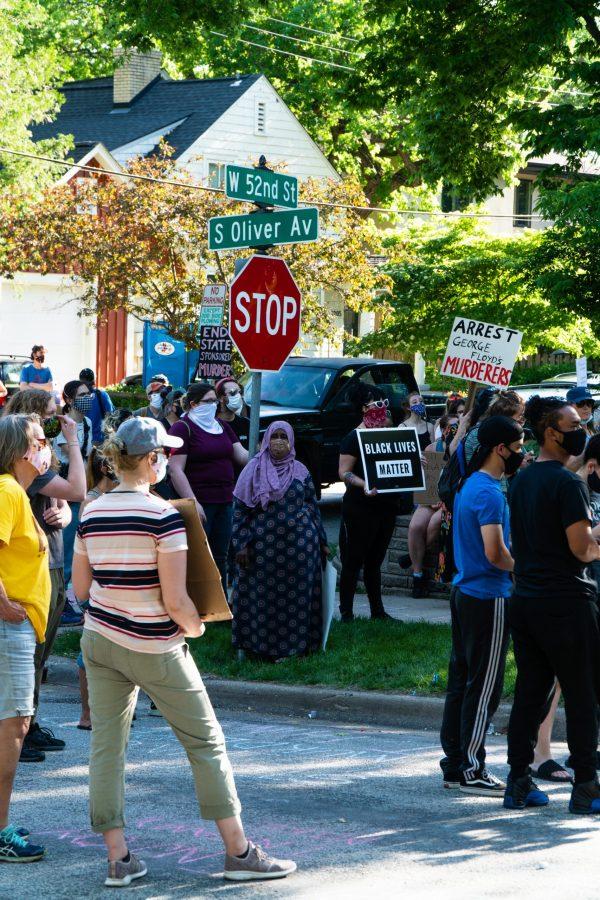 Demontrators holding signs and chanting the name of No justice, no peace, prosecute the police, oputside Hennepin County Attorney Mike Freemans home in south Minneapolis. The protests are in reponse to the murder of George Floyd. Thursday, May 28, 2020. (Photo courtesy of Ben Leonard)