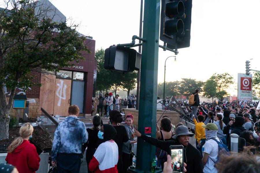People tearing down the fence that was in front of the Minneapolis PDs 3rd precinct and beginning to smash windows. The riots were in repsonse to the murder of George Floyd. Thursday, May 28, 2020. (Photo courtesy of Ben Leonard)
