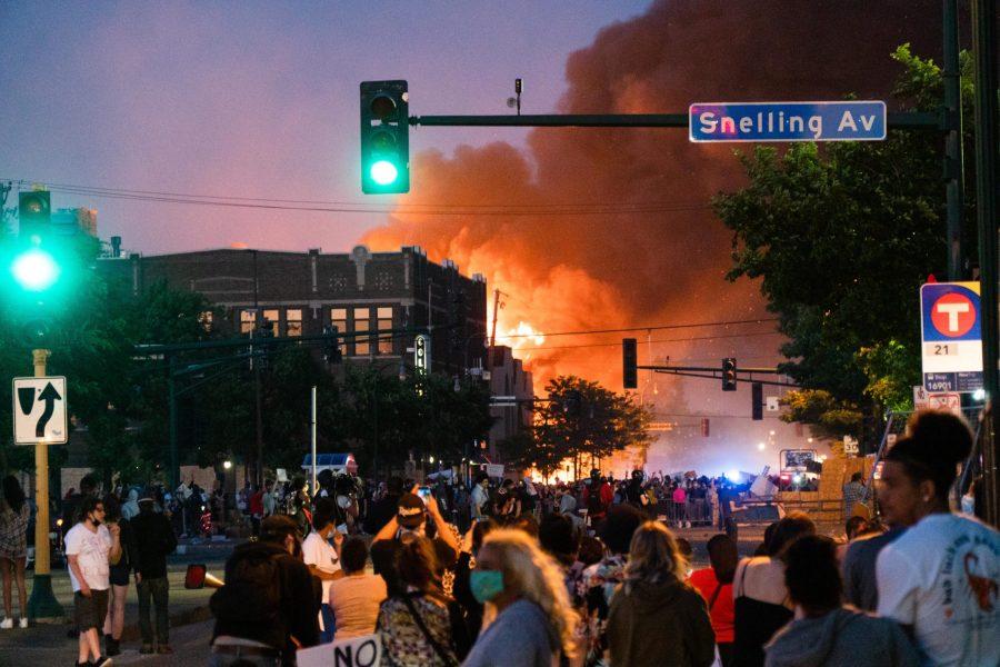 A building on fire near Lake Street and Minnehaha Avenue in Minneapolis, May 28. (Ben Leonard | The Collegian)