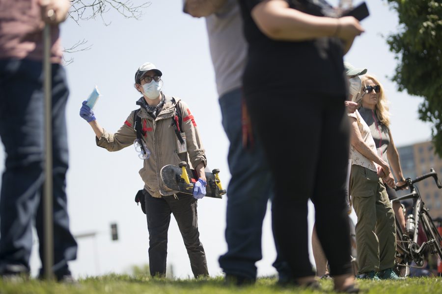 A first aid responder walks around the crowd of protestors in Kansas City, Missouri offering free masks. (Lucy Morantz | The Collegian)