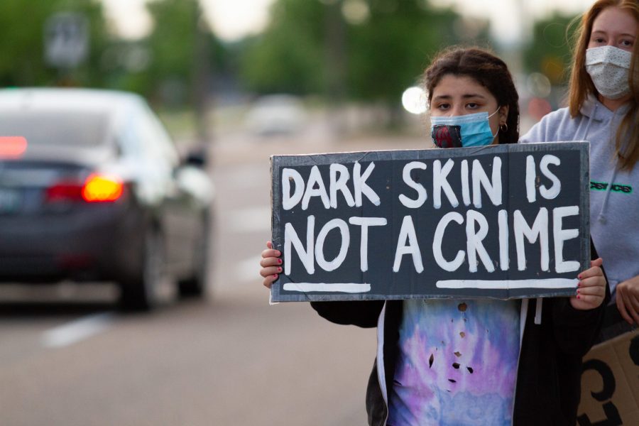 Protestors gather outside of the Fort Collins Police Department on Timberline Road holding signs and chanting in solidarity with the protestors in Minneapolis, Minnesota and around the country, June 2. (Matt Tackett | The Collegian)
