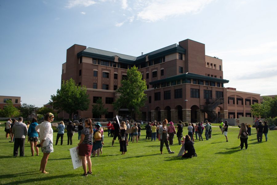 Protesters gather outside of the Larimer County Justice Center June 18 as part of a protest against Scott Gudmundsen, a white man from Loveland, Colorado, who held a Black Colorado State University football player and his co-worker at gunpoint and knelt on his neck. (Matt Tackett | The Collegian)