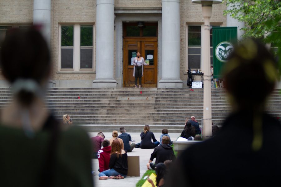 Nina Sobieski speaks to a crowd gathered in front of the Colorado State University Administration Building for the Juneteenth rally June 19. (Matt Tackett | The Collegian)