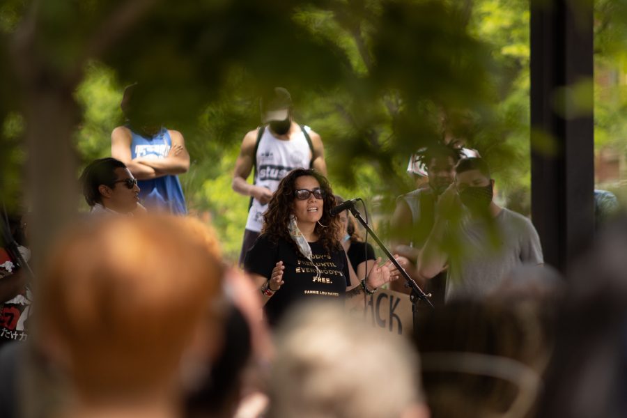 A speaker encourages protesters to buy form black businesses in Fort Collins to help support them, during a protest at  Old Town Square on June 5, 2020. (Devin Cornelius | Collegian)