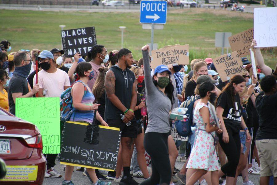 Protestors return to the Aurora Municipal Center after marching. Protestors blocked the flow of traffic at one point during the evening. (Katrina Leibee | The Collegian).
