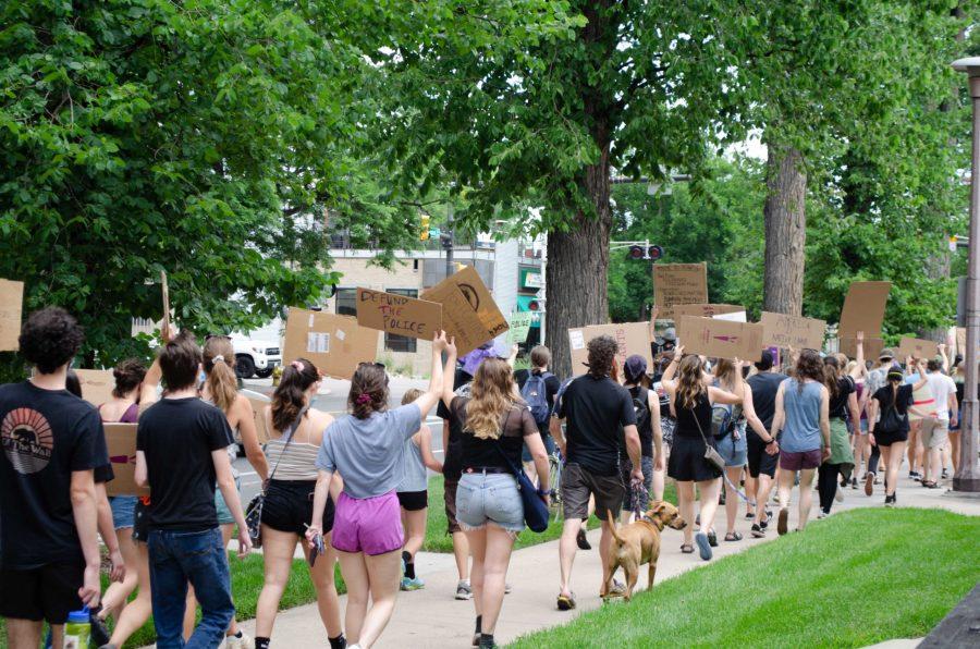 Protestors walk chanting Black lives matter. (Reed Slater | Collegian)