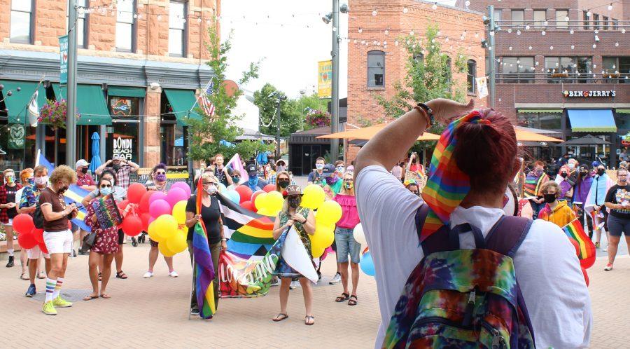 NoCo SafeSpace found Kimberly Chambers speaks to the crowd of marchers to kick off the second annual Northern Colorado Pride March in Old Town Square July 17, 2020. (Serena Bettis | The Collegian)