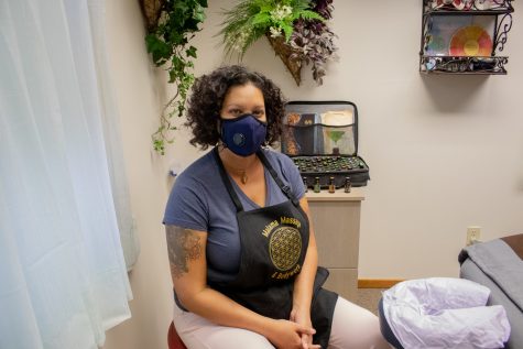 Malama Massage and Bodywork business owner and massage therapist Gina Michelle performs her routine cleaning, in an effort to minimize COVID-19 exposure risk, between clients, July 24. (Anna von Pechmann | The Collegian) 