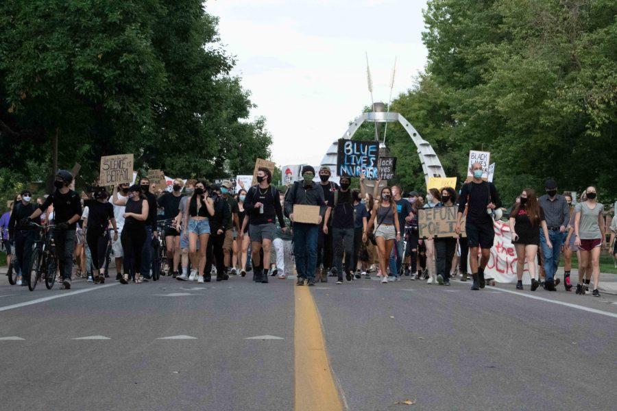 Students march in protest through CSU campus. (Connor McGrath | The Collegian) 