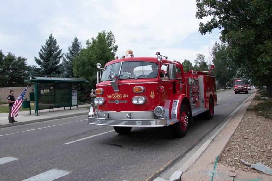 Fire trucks drive down Drake Road as part of the memorial procession honoring Larimer County Department of Natural Resources Ranger, veteran and Colorado State University alum Brendan Unitt Aug. 28. The procession included emergency vehicles from Larimer County, Boulder, Estes, Aurora and Loveland. (Anna von Pechmann | The Collegian) 