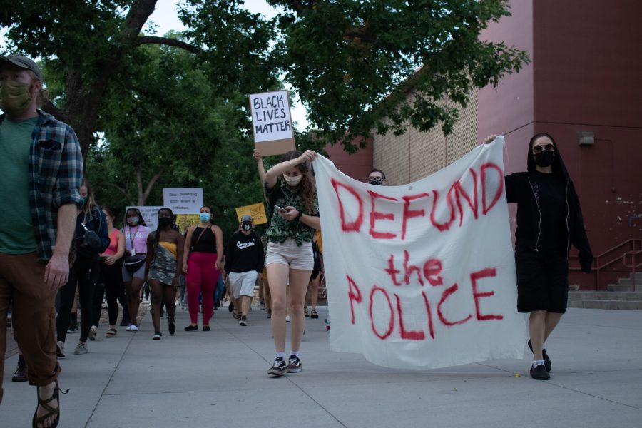 Protestors march through campus from The Oval to the Colorado State University Police Department building Aug. 26. The protest was organized in response to the death of Jacob Blake, who was shot by a police officer in Kenosha, Wisconsin Aug. 23. (Anna von Pechmann | The Collegian) 