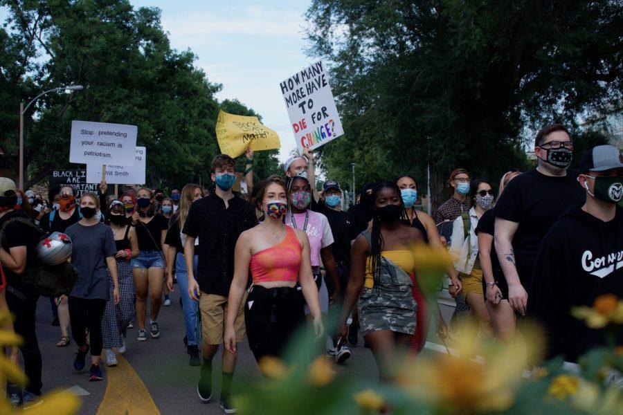 Protesters march through campus from The Oval toward the Colorado State University Police Department building Aug. 26. The protest was organized in response to a police officer shooting Jacob Blake in Kenosha, Wisconsin, Aug. 23. (Anna von Pechmann | The Collegian) 