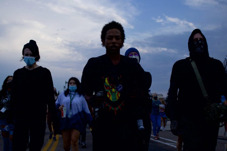 Protesters walk through campus toward West Laurel Street Aug. 26. The protest was organized in response to a police officer shooting Jacob Blake in Kenosha, Wisconsin, Aug. 23. (Anna von Pechmann | The Collegian) 