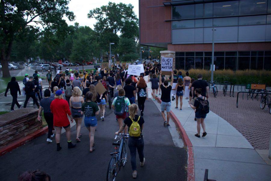 After protesting outside of the Colorado State University Police Department building, protestors walk towards W Laurel St. to continue the march Aug. 26. The protest was organized in response to the death of Jacob Blake, who was shot by a police officer in Kenosha, Wisconsin Aug. 23. (Anna von Pechmann | The Collegian) 