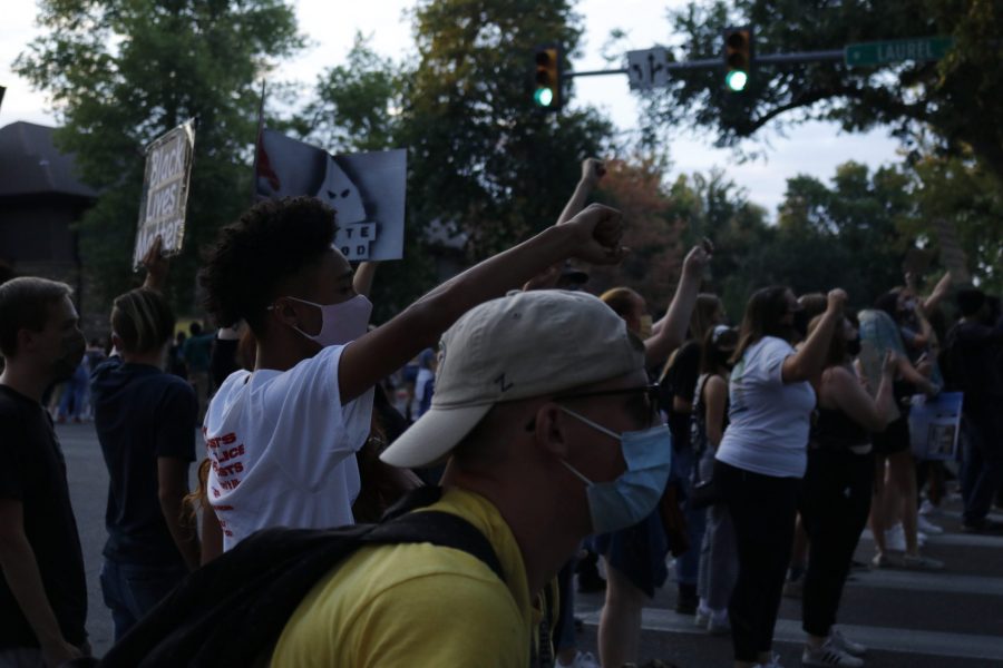 Protestors line the crosswalks of the the intersection of W Laurel St. and S Howes St. Aug. 26. The protest was organized in response to the death of Jacob Blake, who was shot by a police officer in Kenosha, Wisconsin Aug. 23. (Anna von Pechmann | The Collegian) 