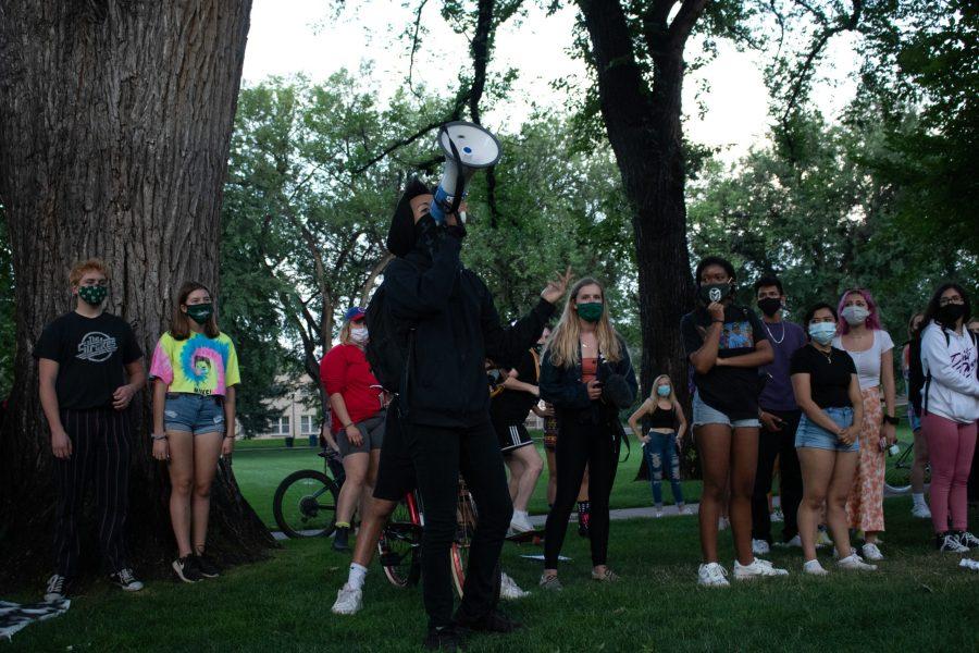 Protestor speaks to a crowd at The Oval after a march to the Colorado State University Police Department building Aug. 26. The protest was organized in response to the death of Jacob Blake, who was shot by a police officer in Kenosha, Wisconsin Aug. 23. (Anna von Pechmann | The Collegian) 