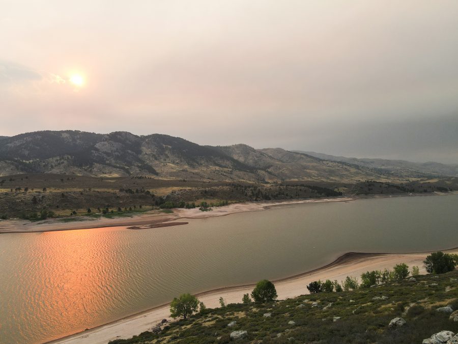 After weeks of wildfires close to Fort Collins, Horsetooth Reservoir sits in a cloud of smoke Sept. 7. In addition to the Fort Collins region being covered by a blanket of smoke, a layer of ash covered cars and the sidewalks. (Lucy Morantz | The Collegian)