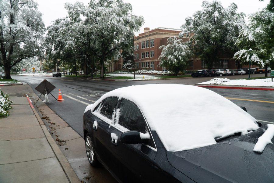 A snow covered car outside the University Center For The Arts. (Ben Leonard | The Collegian)