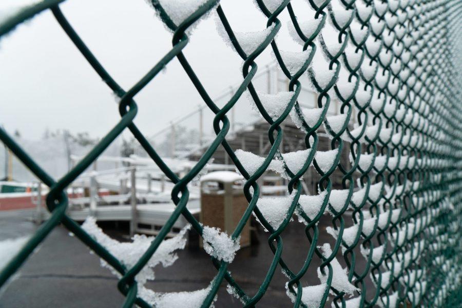 Snow gathered on a chainlink fence along the Mason Trail.