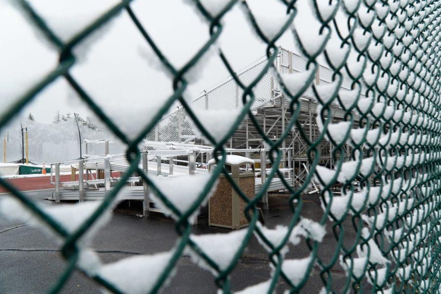 Snow gathered on a chainlink fence along the Mason Trail. (Ben Leonard | The Collegian)