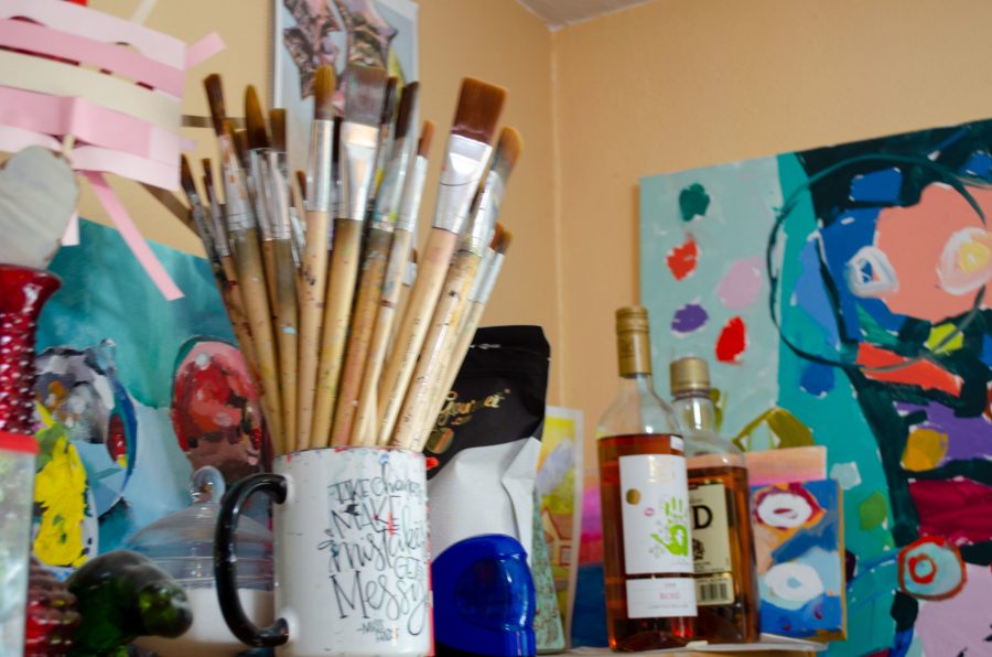 A mug of paintbrushes in Parkers studio. (Reed Slater | Collegian)