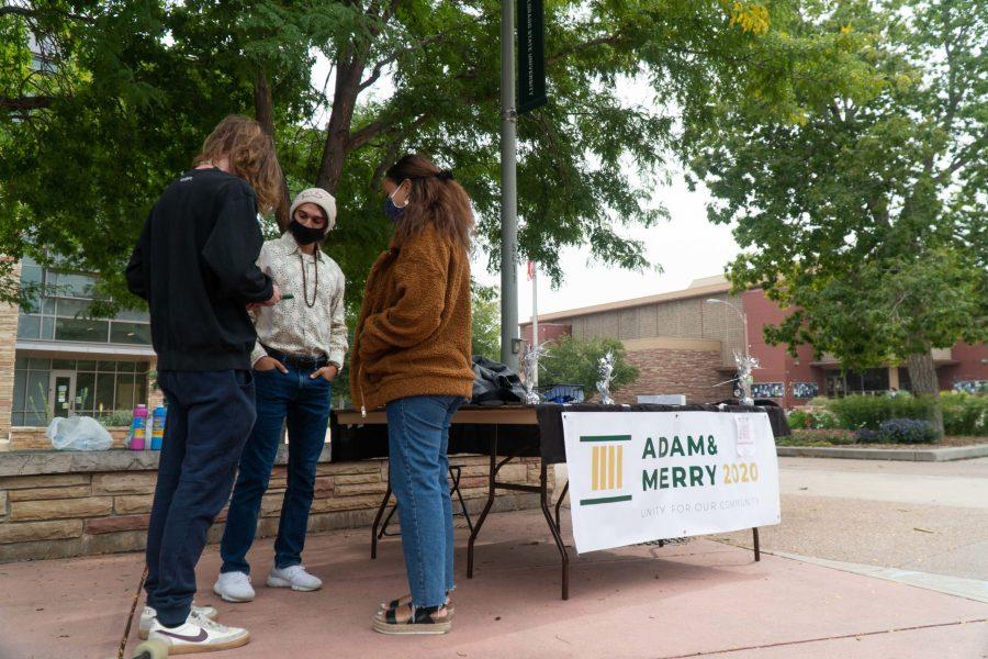 Adam and Merry talk with a student about their campaign. (Ben Leonard | The Collegian)