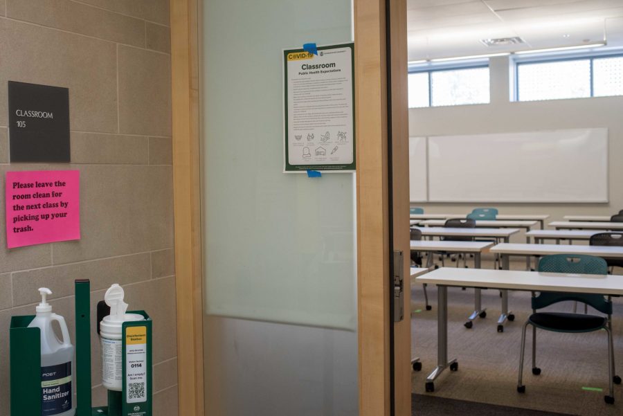 Hand sanitizers and disinfectant wipes are placed outside every classroom for students and faculty to ensure hygiene as they come for in person classes Sept. 1, 2020. (Pratyoosh Kashyap | The Collegian)