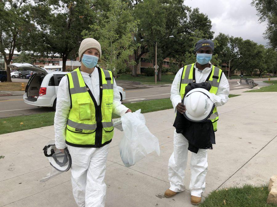 Workers put protective gear on before testing wastewater on campus. (Photo courtesy of Susanne Cordery, Colorado State University)