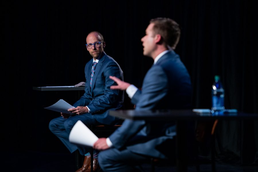 9News reporter Marshall Zelinger watches as co-moderator Kyle Clark asks Sen. Cory Gardner a question Oct. 13. (Lucy Morantz | The Collegian) 
