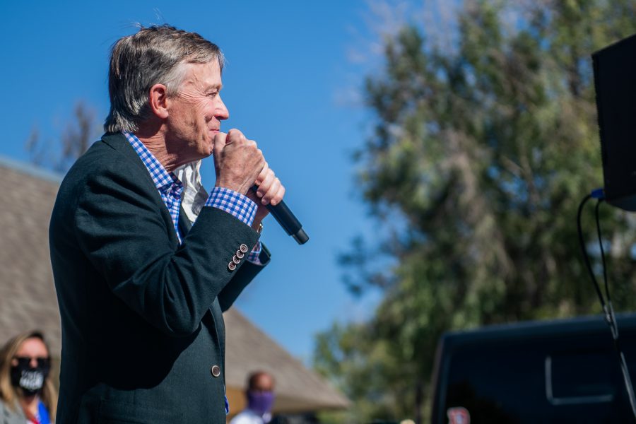 Former Colorado Gov. John Hickenlooper speaks to a crowd of socially distanced supporters in the parking lot of Nick’s Italian restaurant before the third and final U.S. Senate debate against Sen. Cory Gardner Oct. 13. (Lucy Morantz | The Collegian) 

