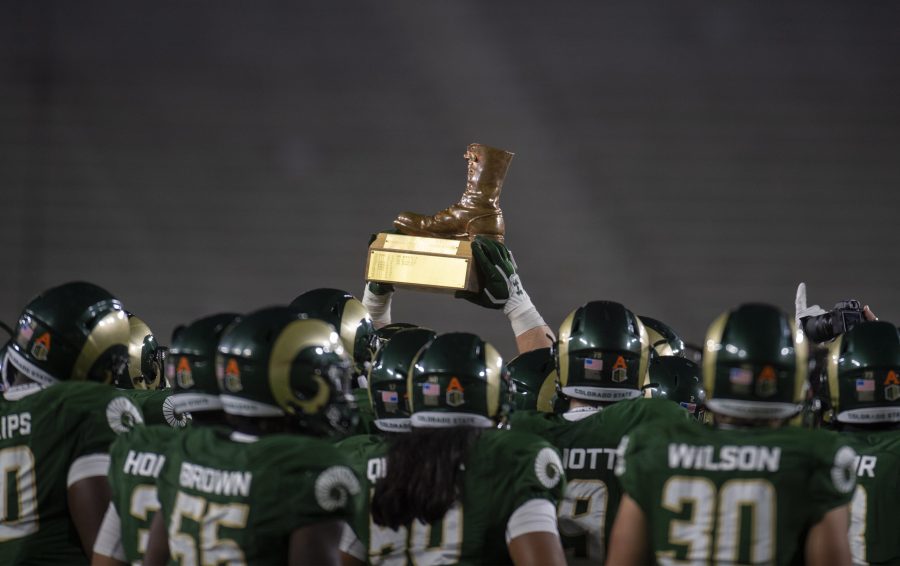 The Colorado State Rams raise the Bronze Boot, a traveling trophy for the winner of the annual Border War football game between Colorado State and Wyoming, after winning the game at Colorado State University in Fort Collins, Colo. on Thursday, Nov. 5, 2020.