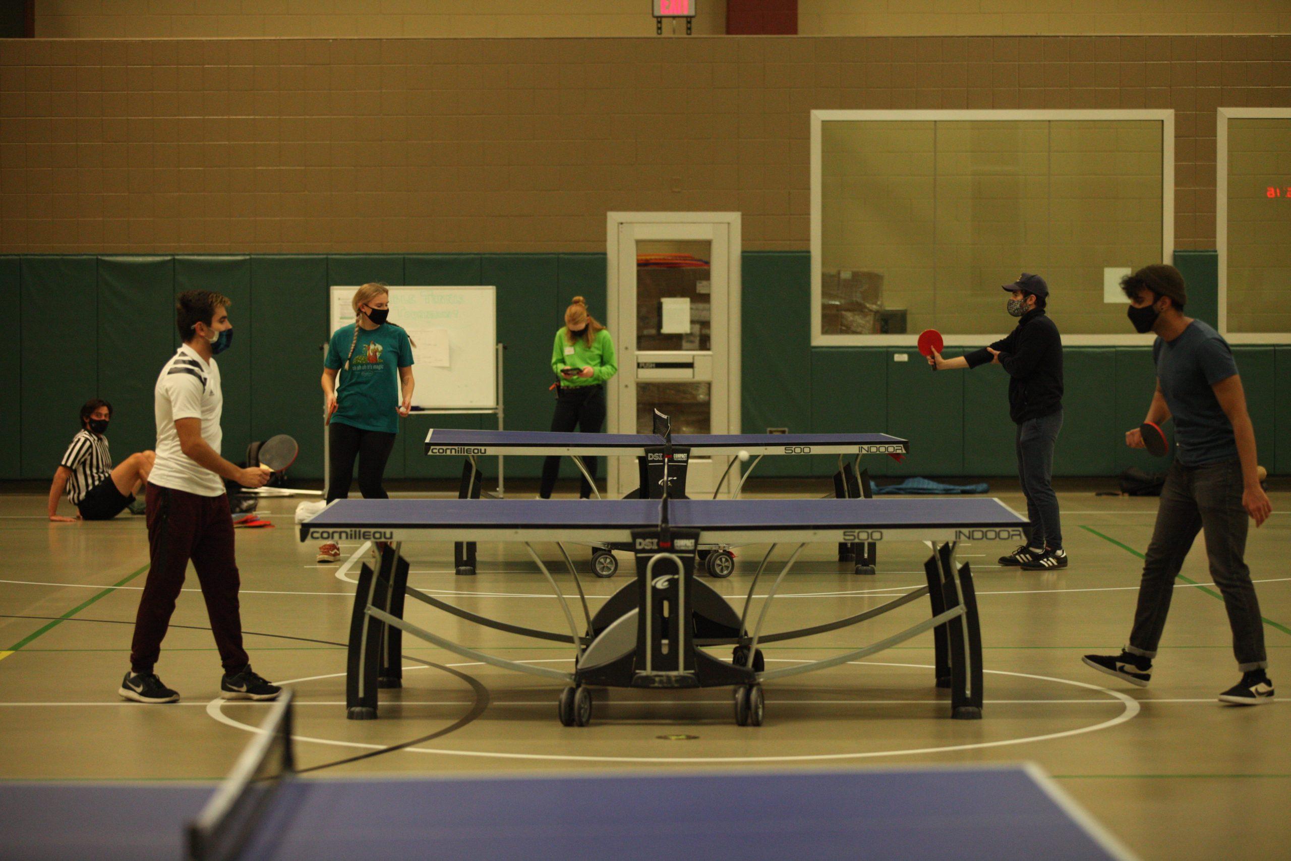 students play table tennis