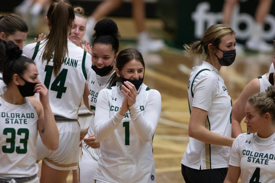 Katia Stamatelopoulos (1) claps and celebrates with her teammates after winning their game against Wyoming 68-65  Feb. 6. (Devin Cornelius | The Collegian)