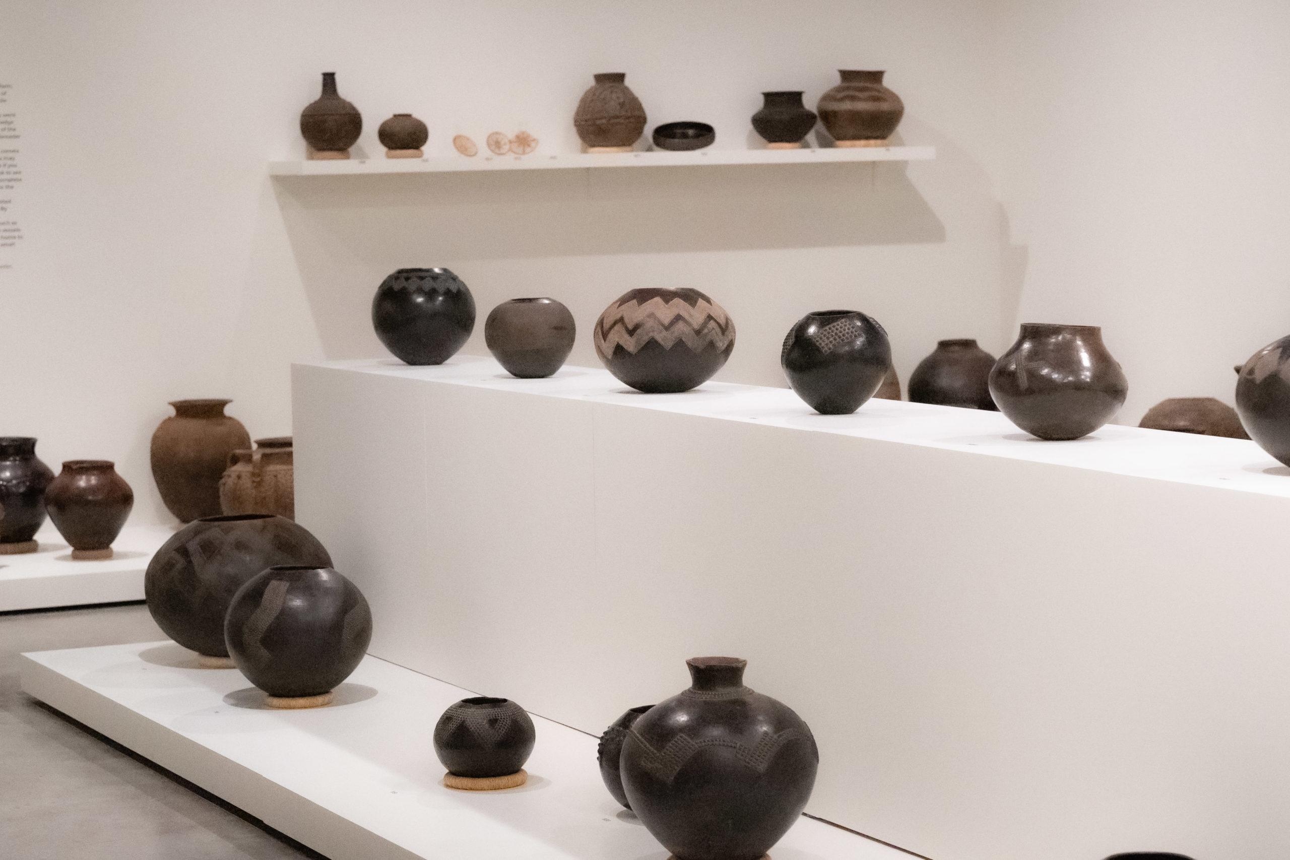 Pots sit in an exhibit