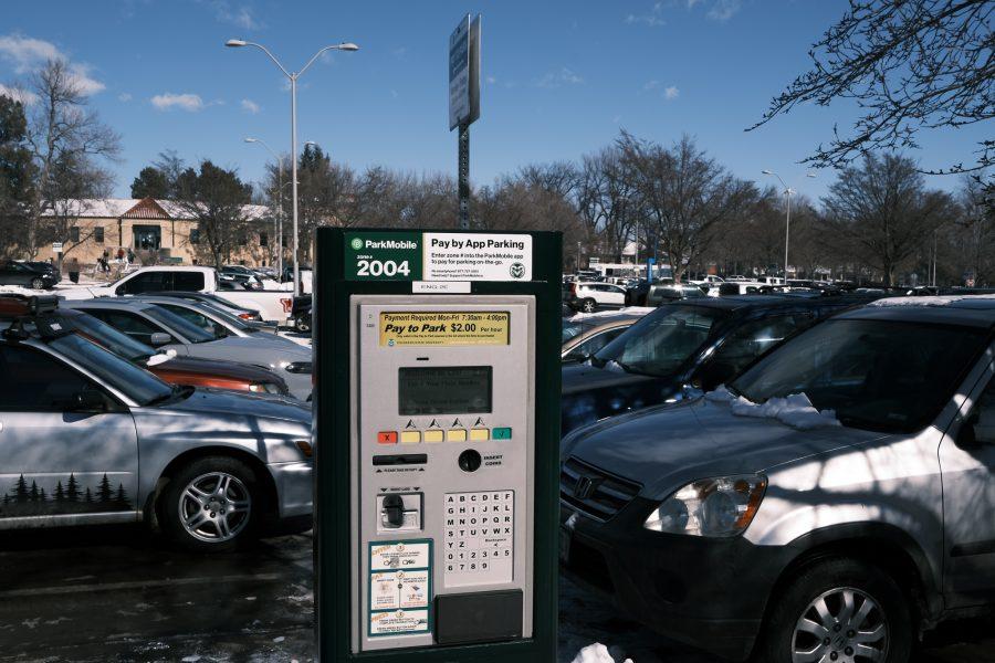 Cars sit behind a parking meter in the north parking lot of the Lory Student Center Jan. 17, 2021.