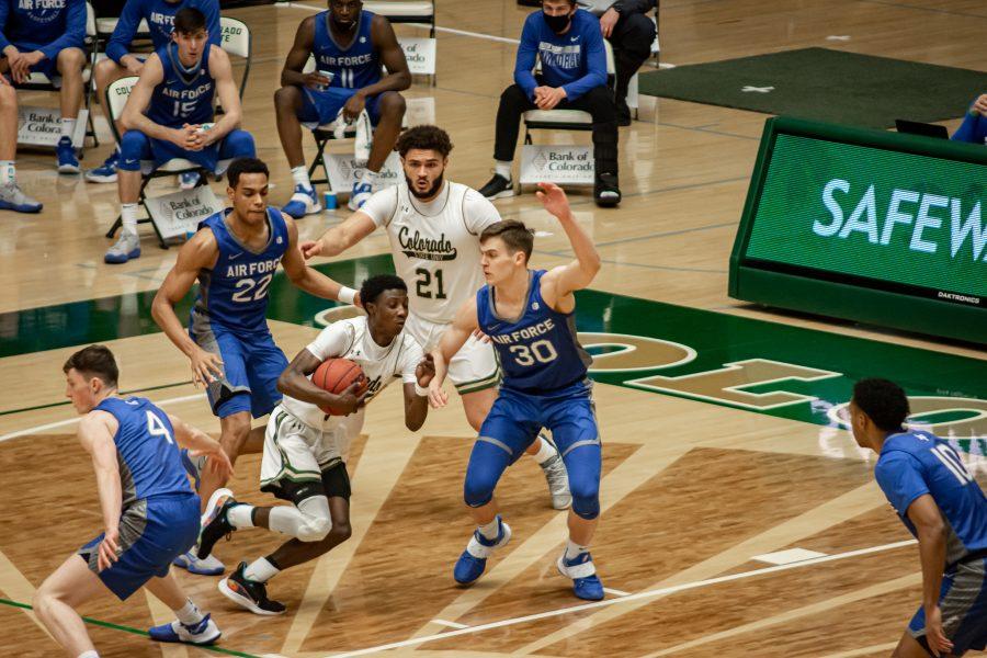 Kendle Moore (3) rushes past the defenders during the University's basketball game vs Air Force, Feb. 27. CSU takes the win 72-49. (Tri Duong | The Collegian)