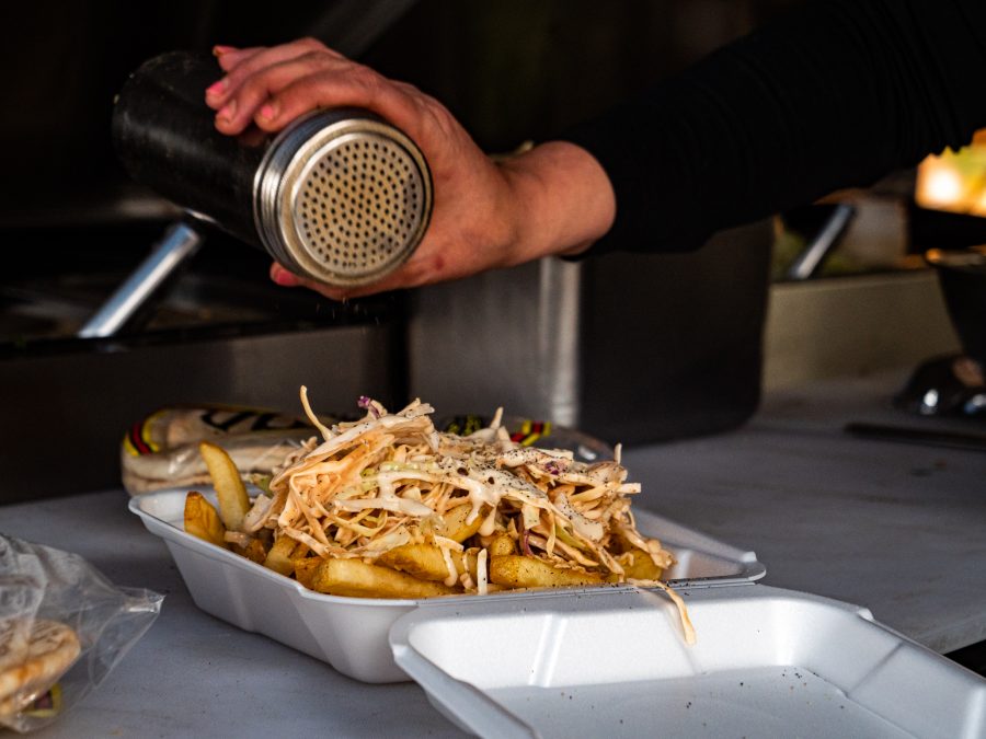 A box of loaded Lebanese fries at Yum Yum Social Club March 4. This version of fries is based on Lebanese street food culture which consists of coleslaw as the additional topping with various spices. (Tri Duong | The Collegian) 