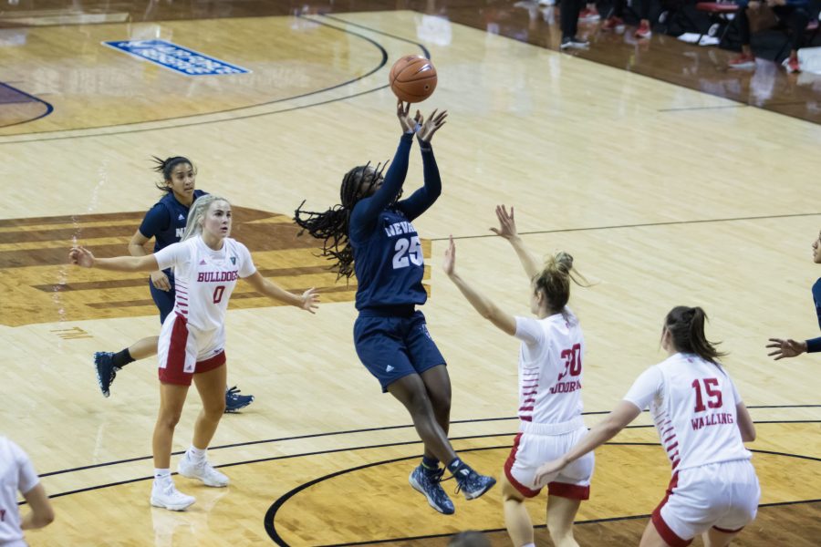 Nia Alexander (25) shoots over a defender in the paint, during the Air Force Reserve Mountain West Women's basketball tournament Mar. 8. California State University Fresno defeats Nevada 70-46. (Devin Cornelius | Collegian)