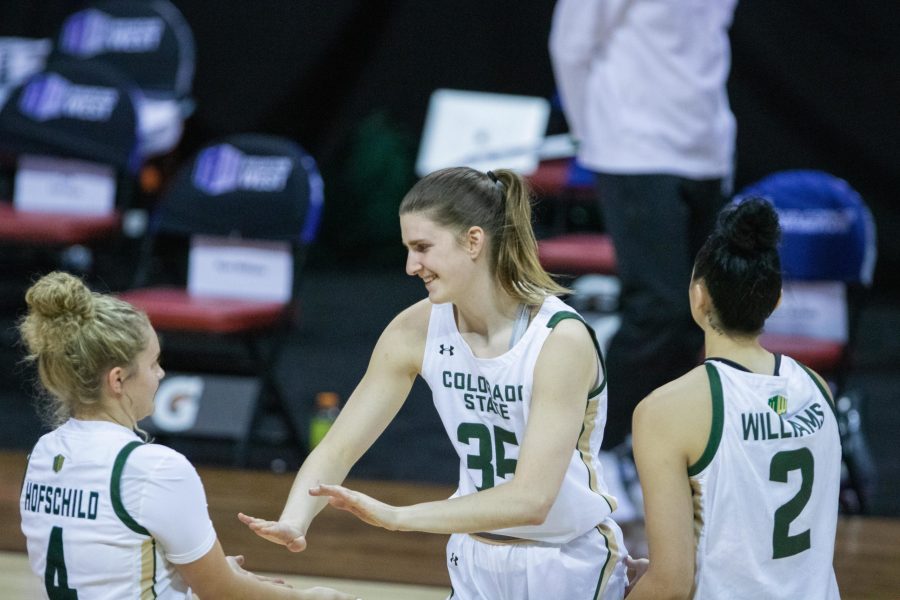 McKenna Hofschild (4) high fives Lore Devos (35) after a timeout during the during the Air Force Reserve Mountain West Womens basketball tournament Mar. 8. Boise State University upsets CSU 78-65. (Devin Cornelius | Collegian)