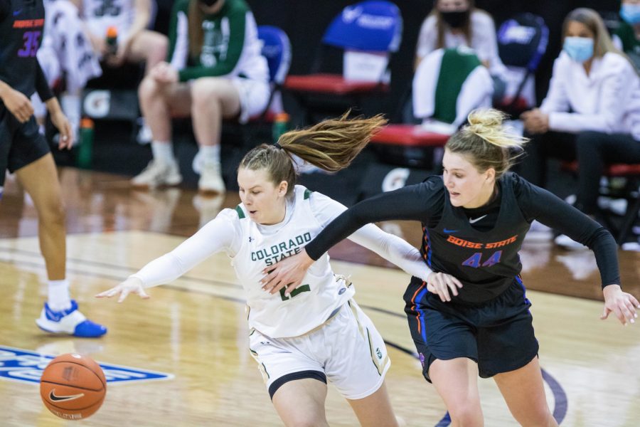 Jamie Bonnarens (12) fights to get possession of the ball during, the Air Force Reserve Mountain West Women's basketball tournament Mar. 8. Colorado State University falls to Boise State University 78-65.  (Devin Cornelius | Collegian)