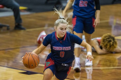 Haley Cavinder (0) dribbles down the court after a rebound in last few seconds of the game, during the Air Force Reserve Mountain West Womens basketball tournament Mar. 9. California State University Fresno upset the New Mexico 77-72. (Devin Cornelius | Collegian) 